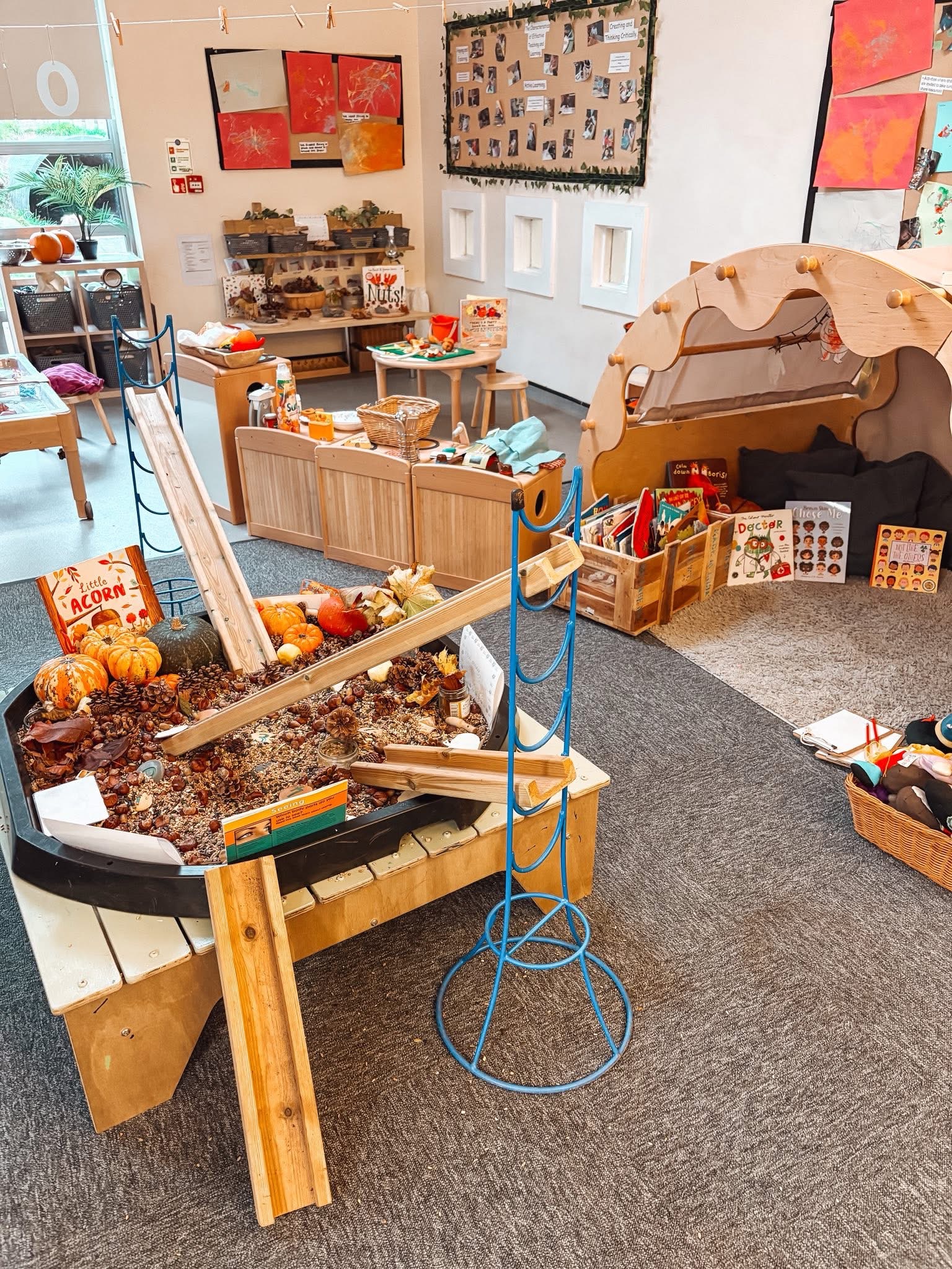 Children learning with a nursery practitioner at Tiny Toez Westfield